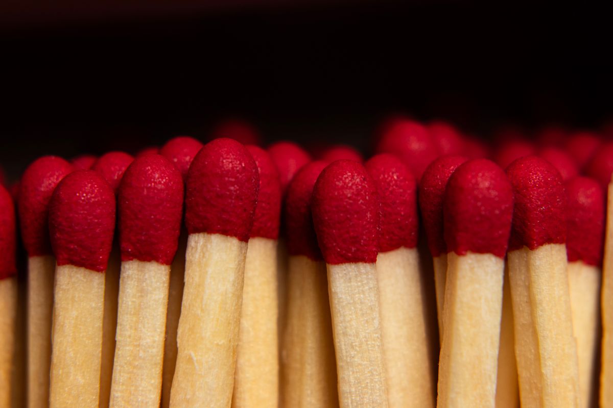 Matches and small household goods stacked in a store.